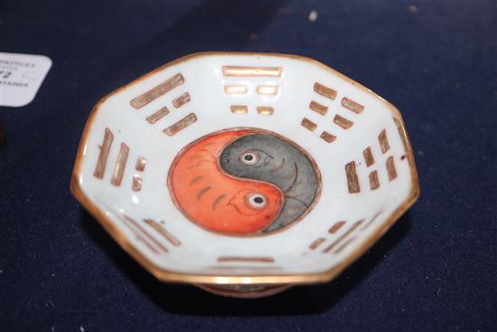 A Chinese small octagonal eight trigrams dish, Tongzhi mark and period (1862-74) and a Chinese blue and white cup Dish diameter 10cm